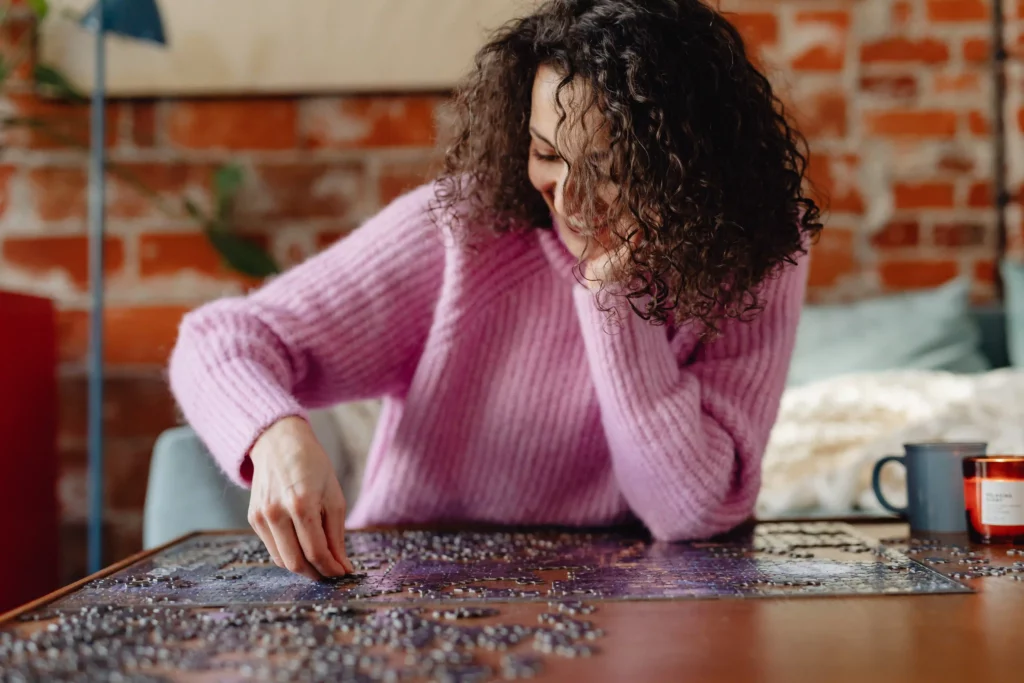 Woman doing the Jigsaw puzzle